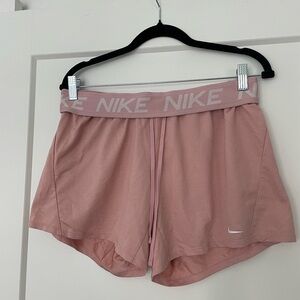 NIKE Women's Dri-Fit Attack Mid-Rise 5 inch Unlined Pink Shorts